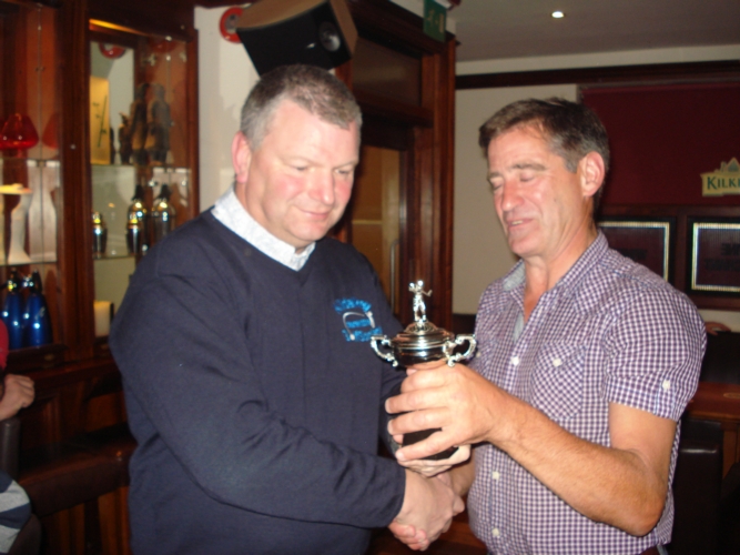 Kildalkey Captain Trevor Darling (left) receives the Ryder Cup from Marcies in 2013